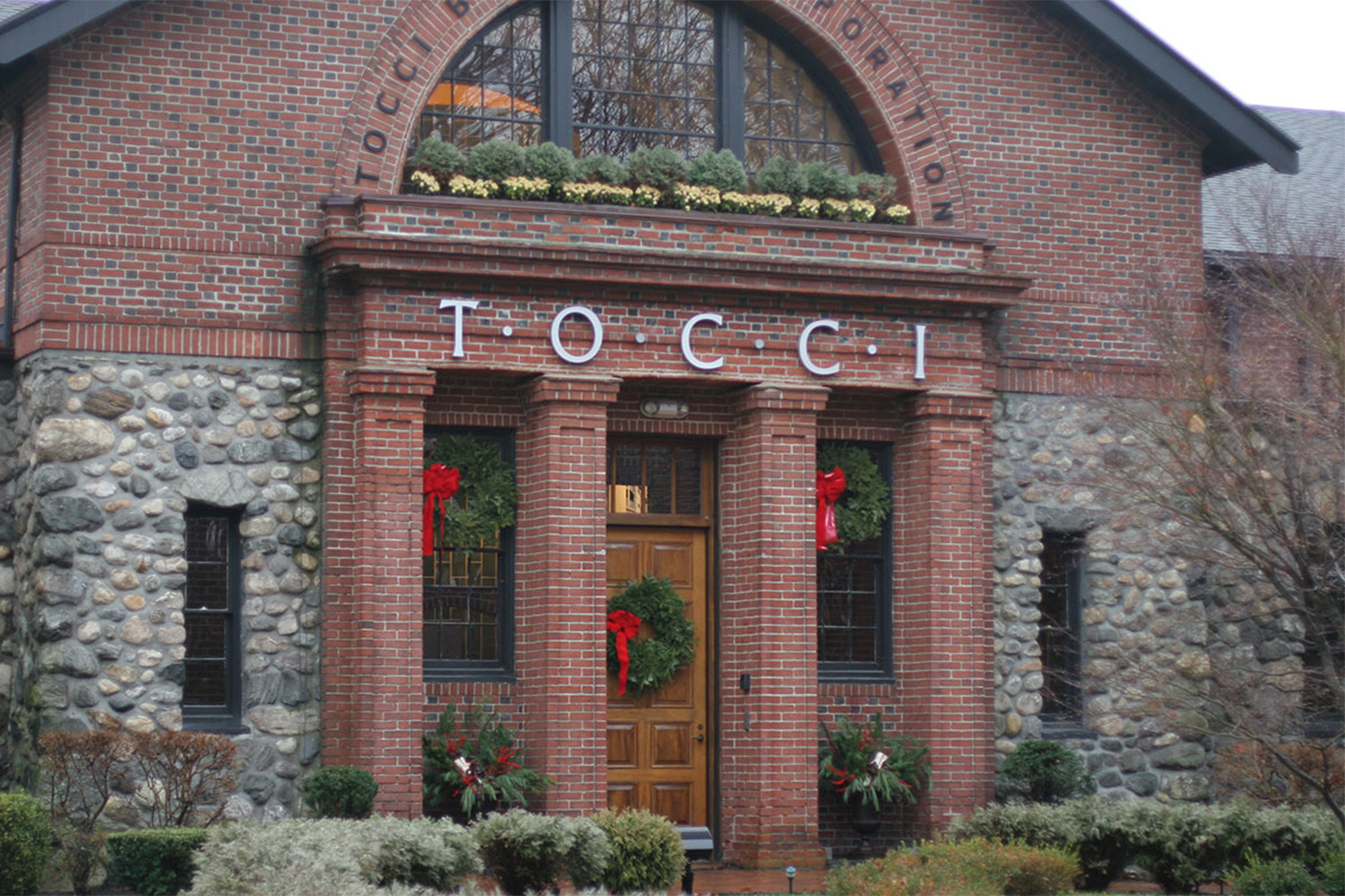 entrance to Tocci office building, with Christmas decorations above entrance door