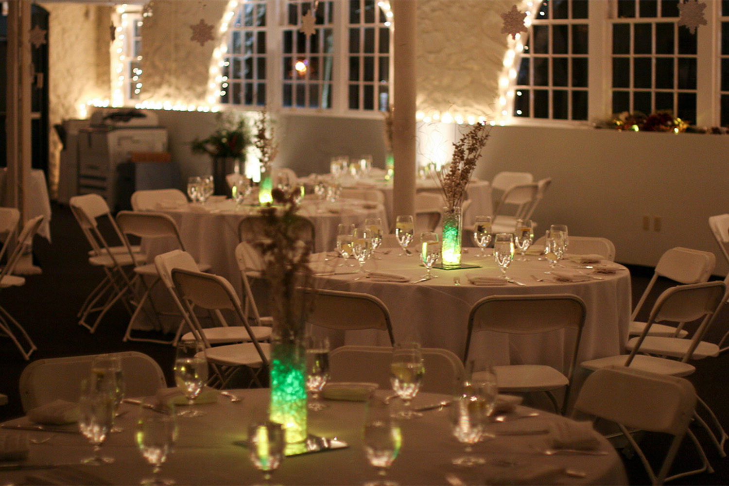 empty tables prepared for the Tocci holiday party 