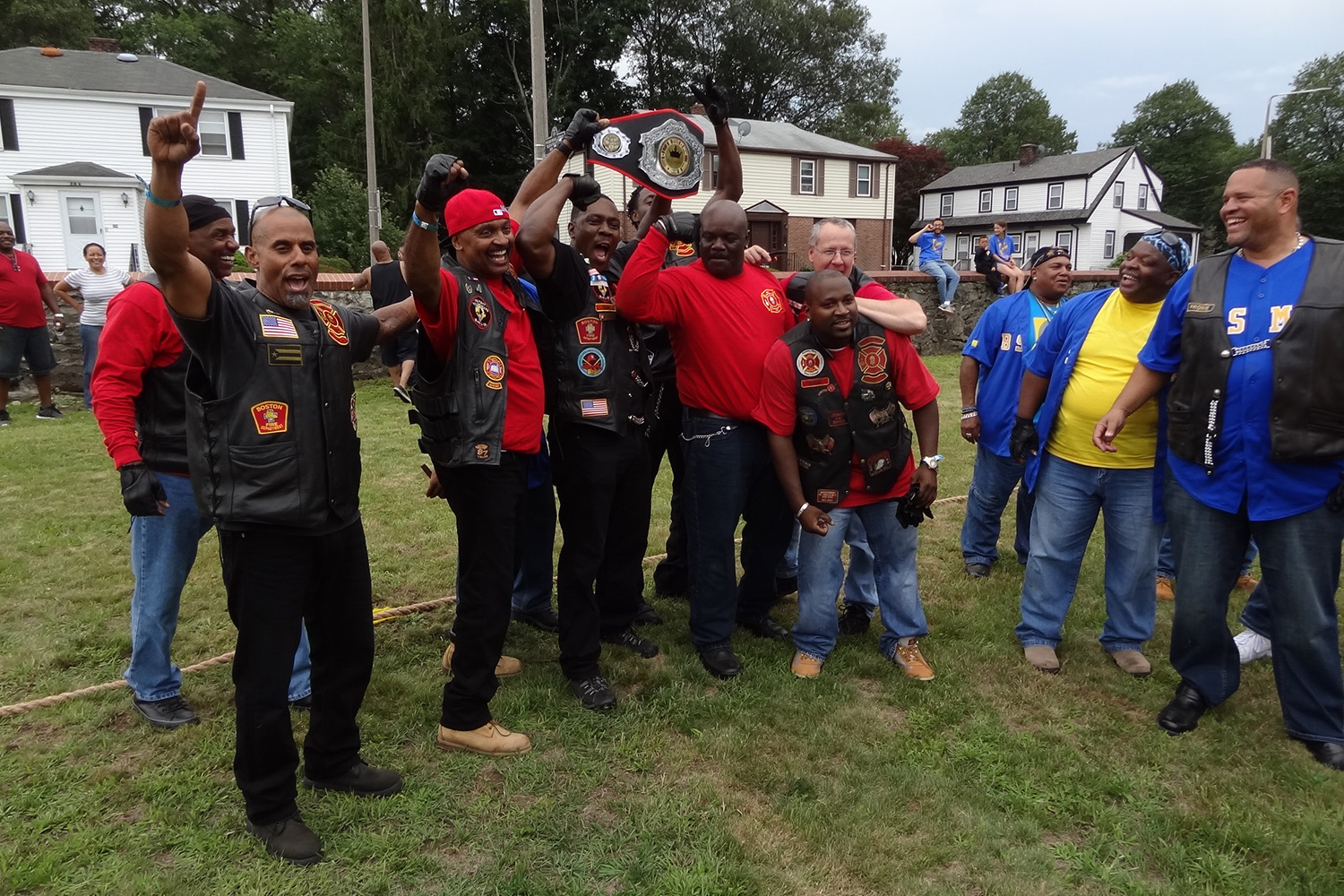 Bikers celebrate, as they won a game of tug-a-war 