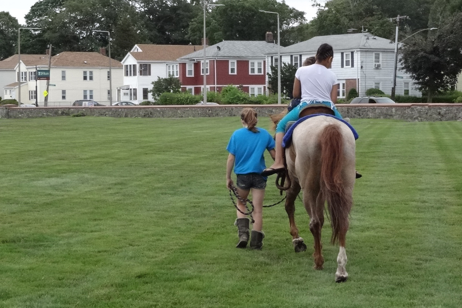 a girl enjoying a horse ride at the Buddy Run event 