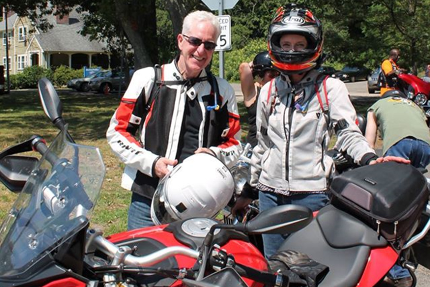 John Tocci posing for photo behind motorcycle, with member of the Buffalo Soldiers motorcycle club 