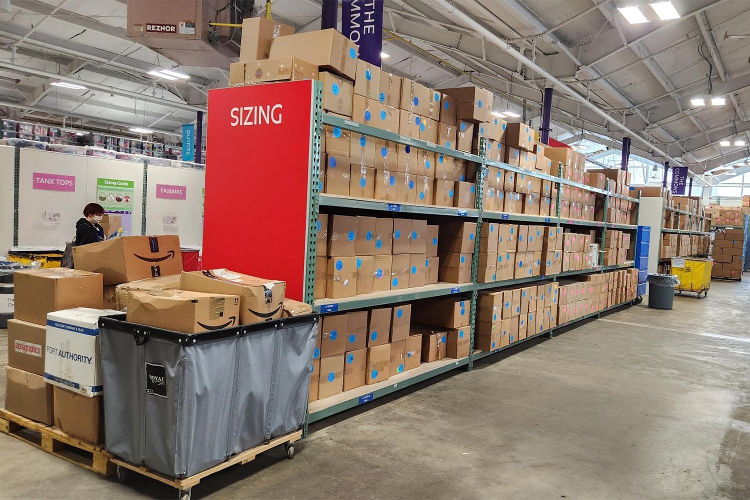 shelves with boxes - Cradles to Crayons storage