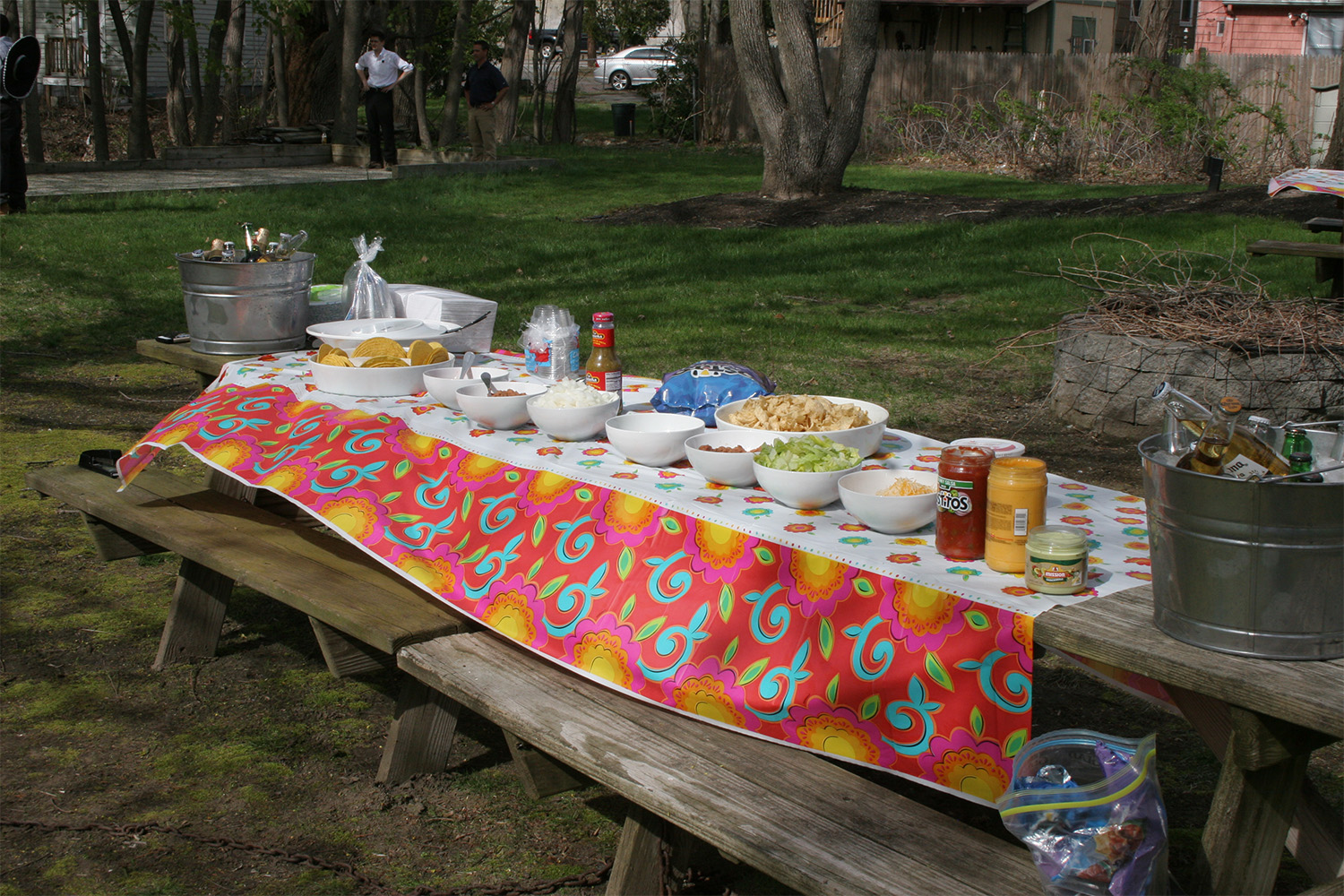 a long table with a spread of various Mexican foods laying on top