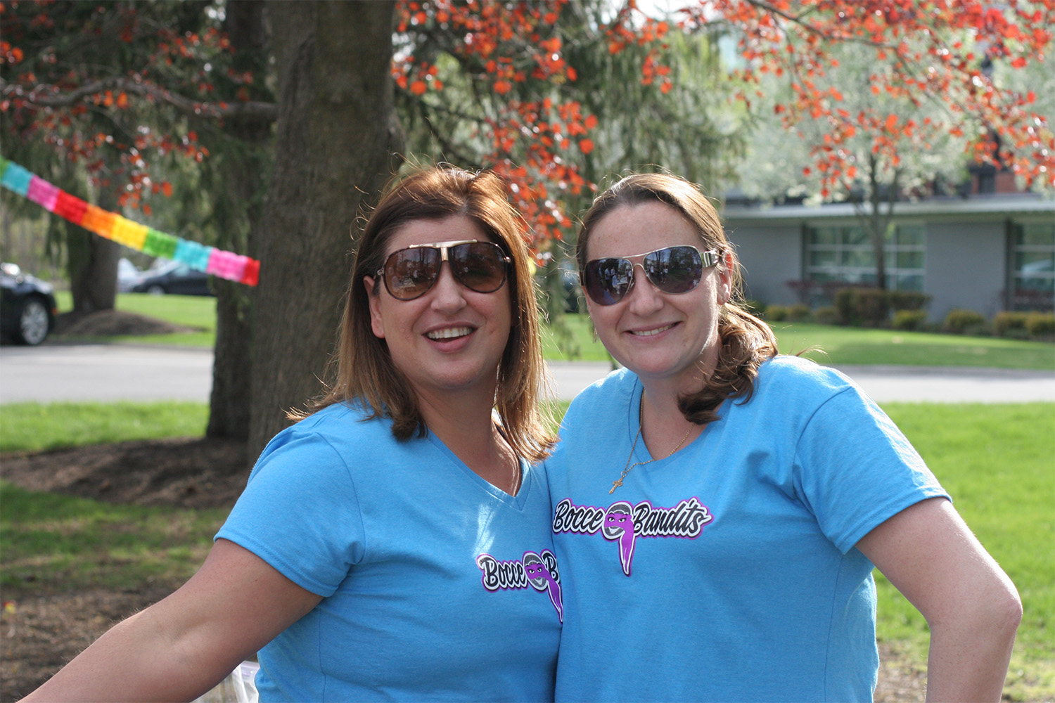 Tammi and Alli wearing matching blue shirts