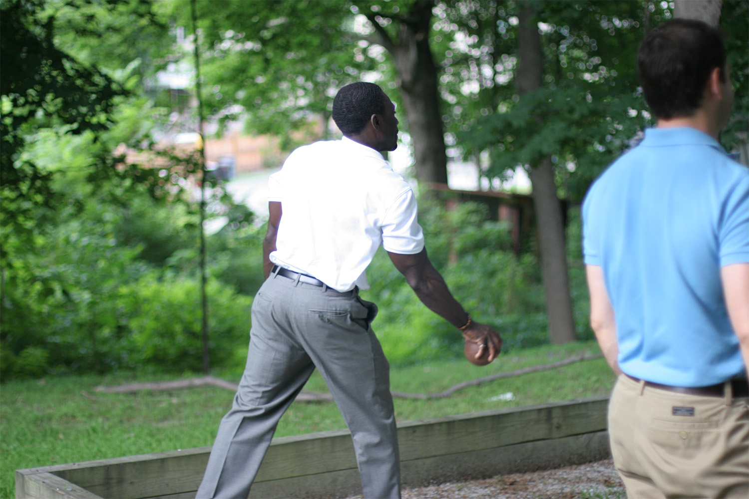 Caleb in a throwing stance, ready to throw the bocce ball
