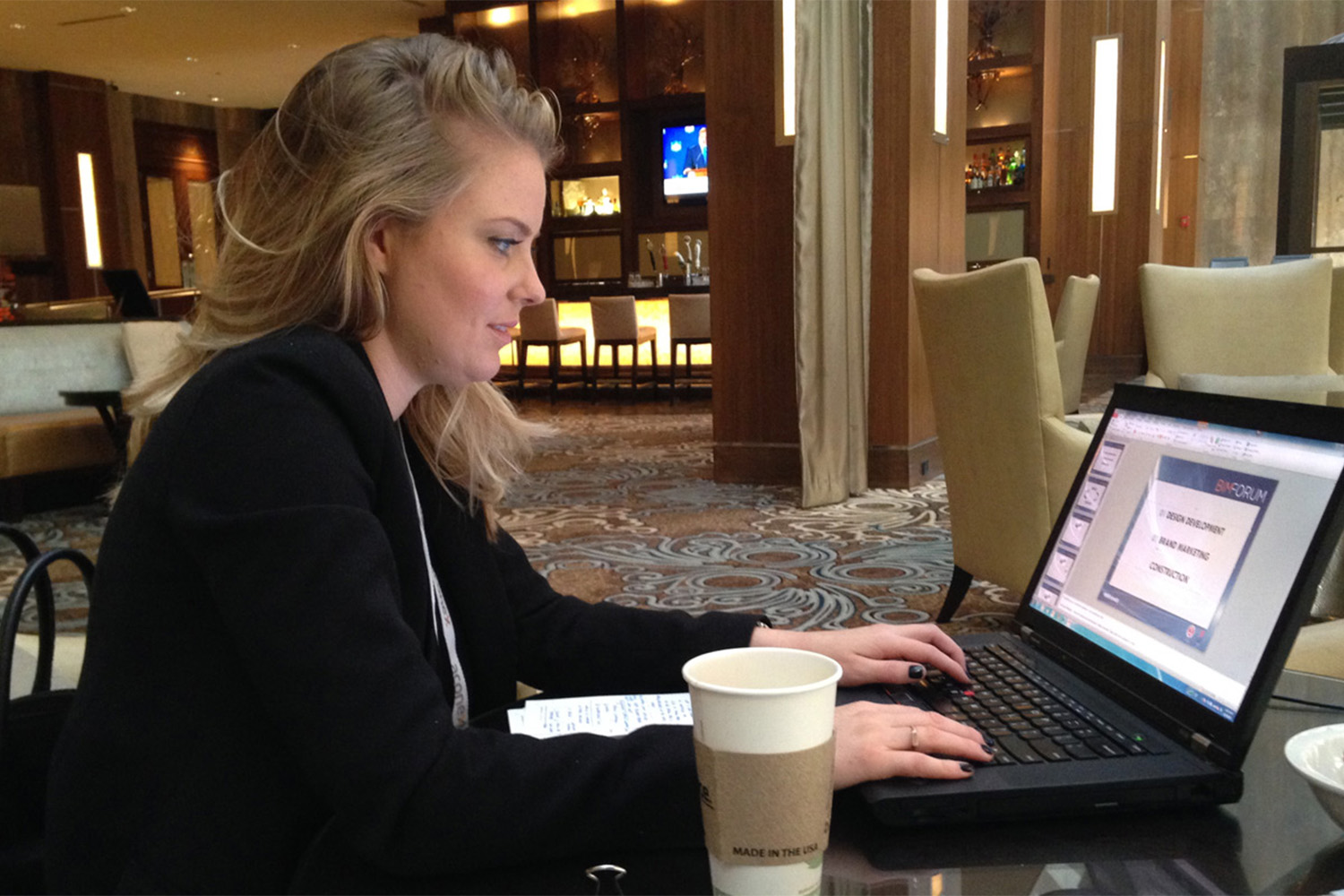 A woman using a laptop at the BIM conference 