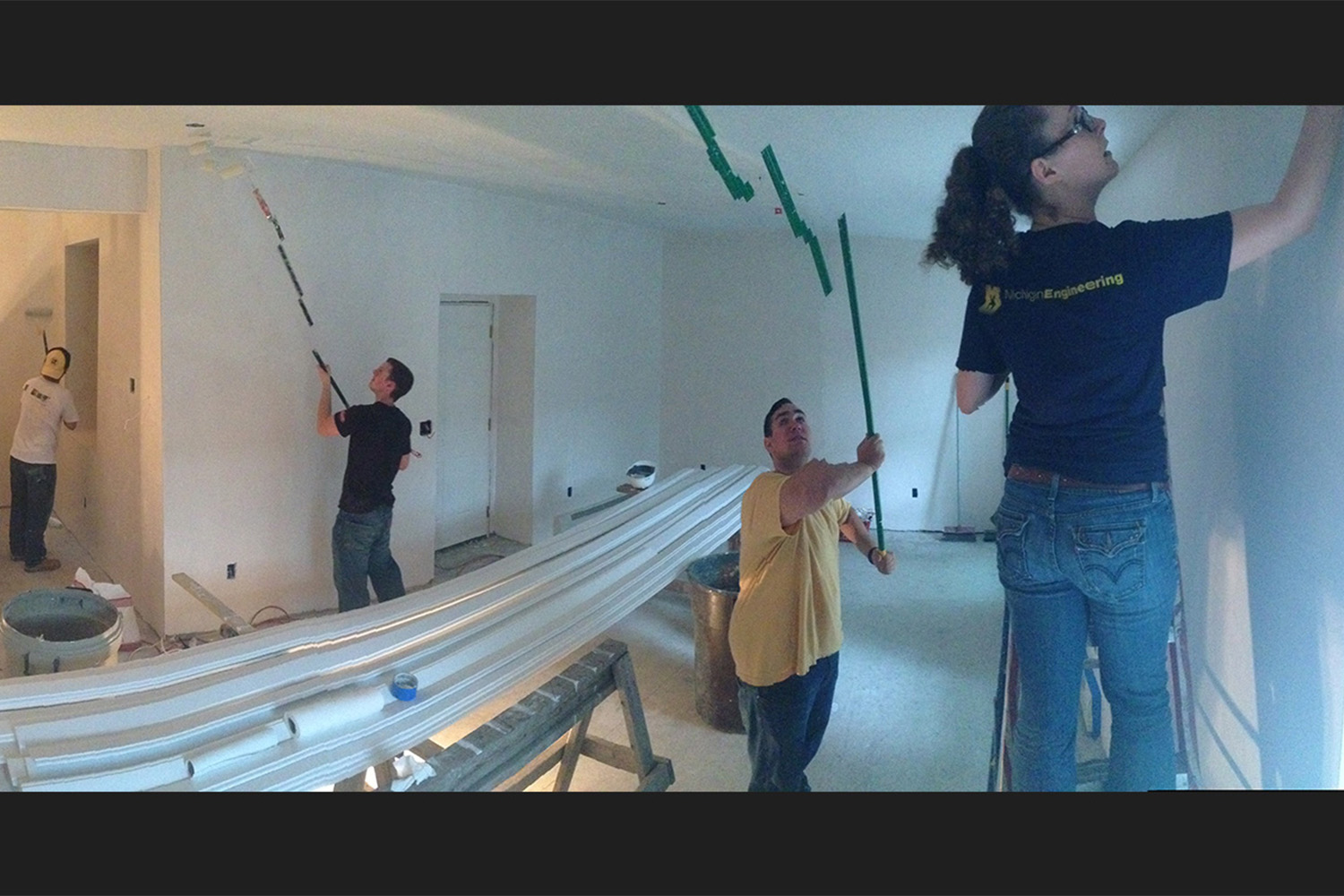 Tocci employees painting a room