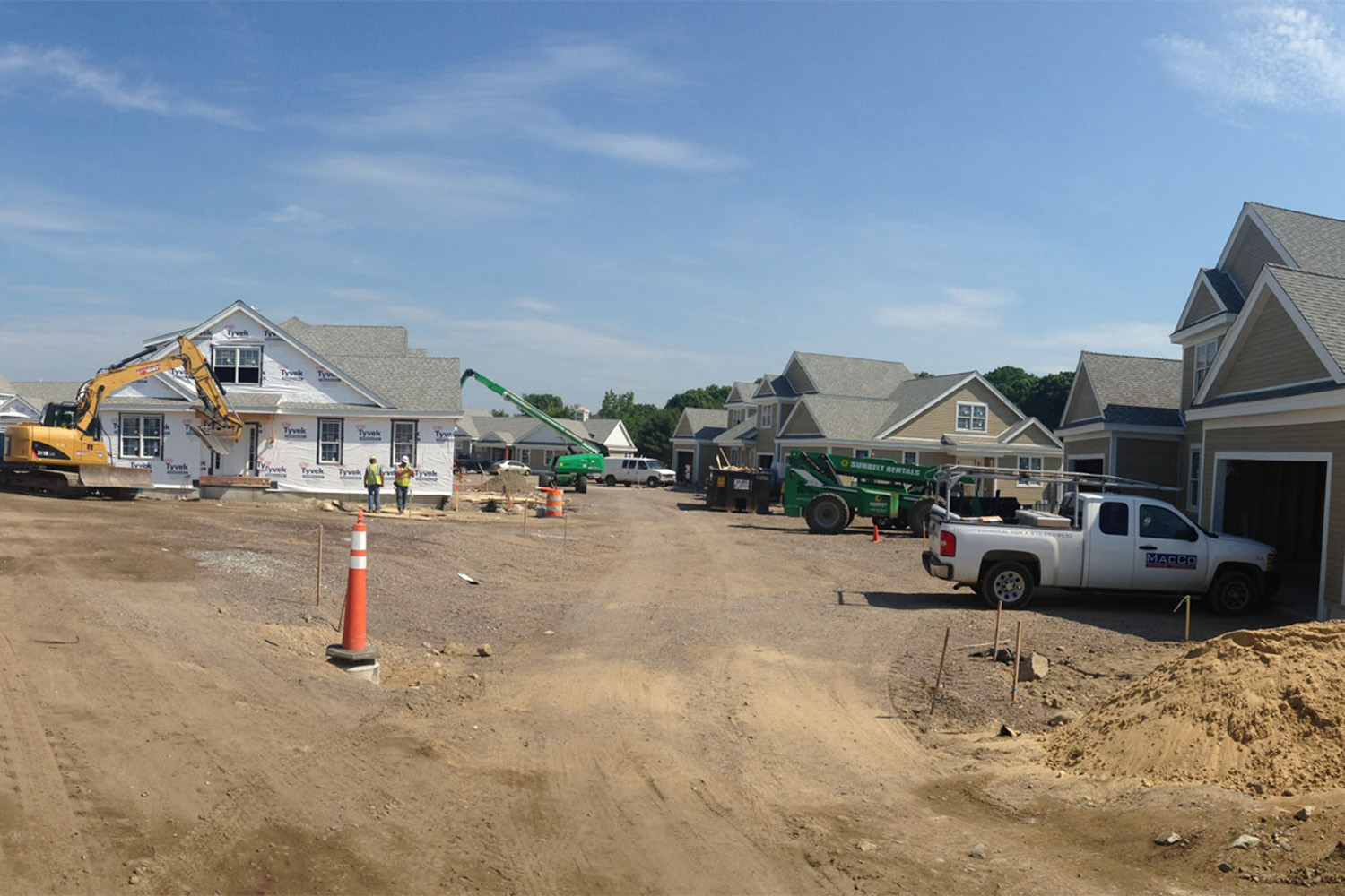 dirt road in between two sections of the construction site 