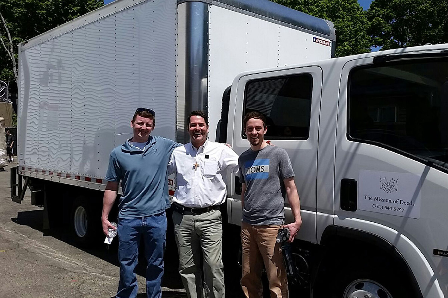 L to R: Ryan, VJ, + Caleb standing in front of white truck