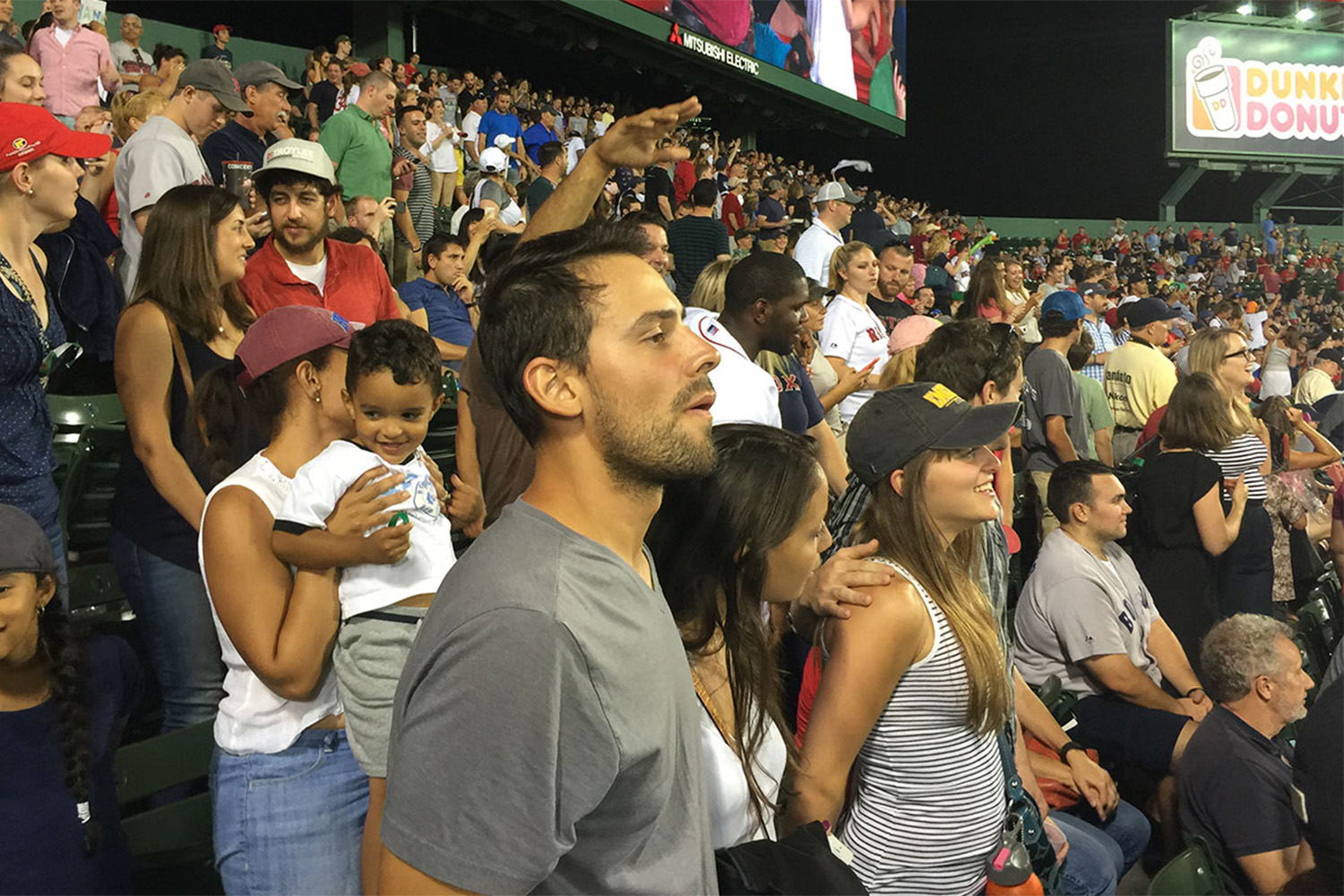 Dancing and singing along to Sweet Caroline at Fenway Park