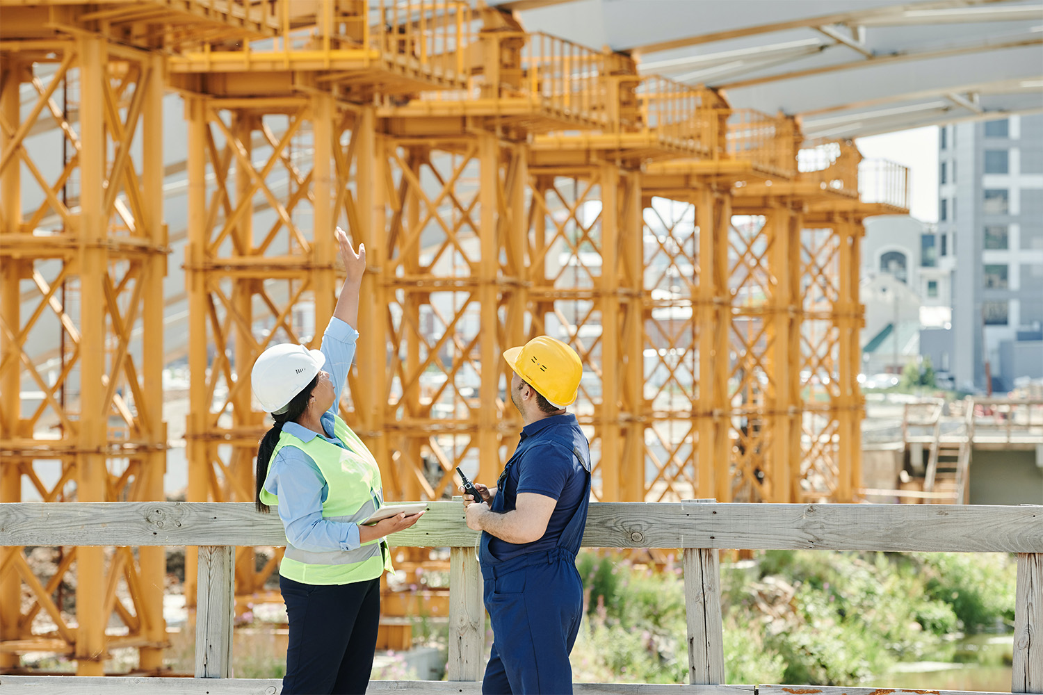 Two construction workers having a discussion at a project site 