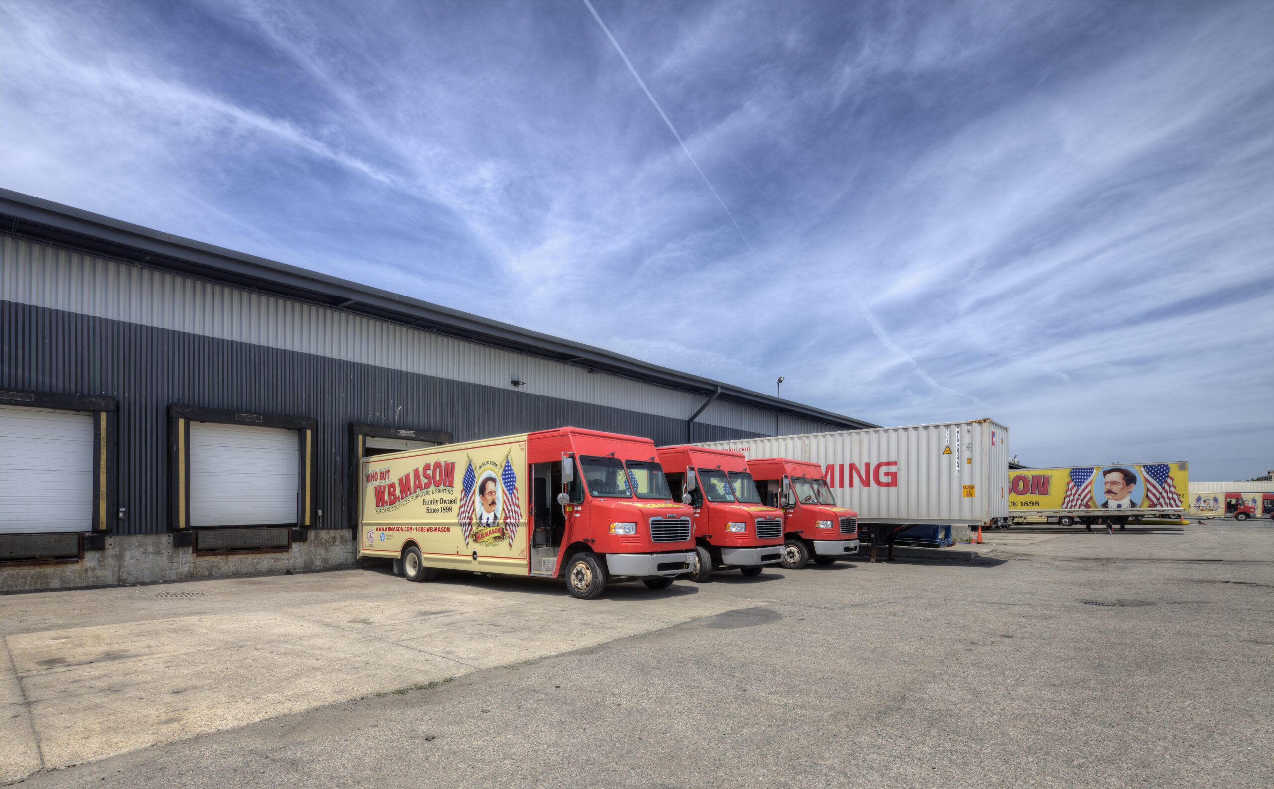 W.B. Mason warehouse on a bright day, with truck parked in front 