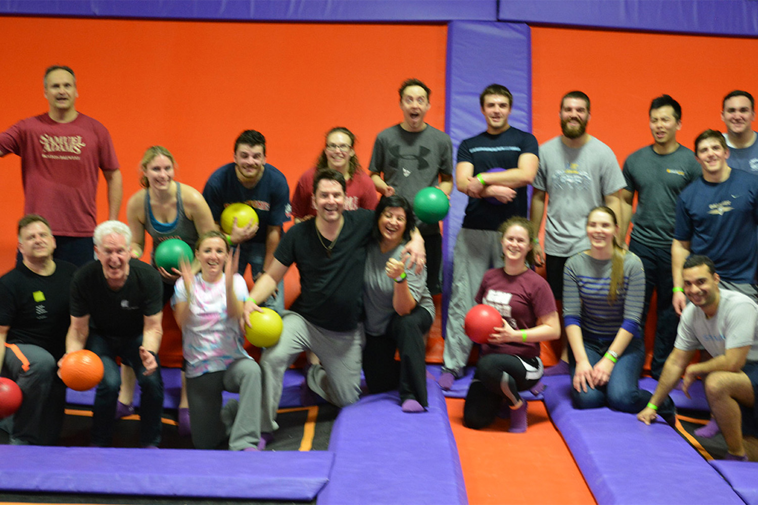 Tocci employees pose for group photo at trampoline park 