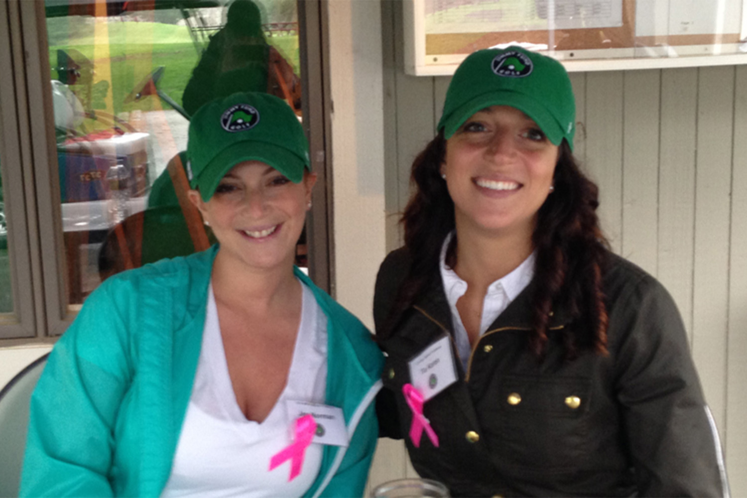 Tia and Jen volunteering at a recent golf tournament.