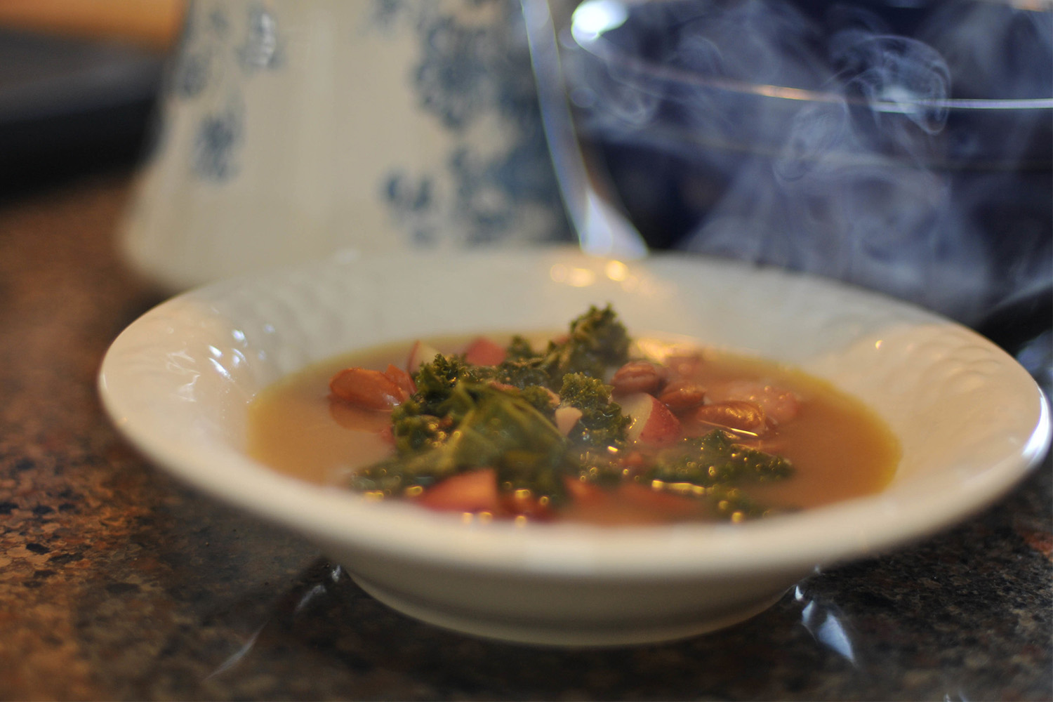 a steaming bowl of Portuguese kale and chorizo soup