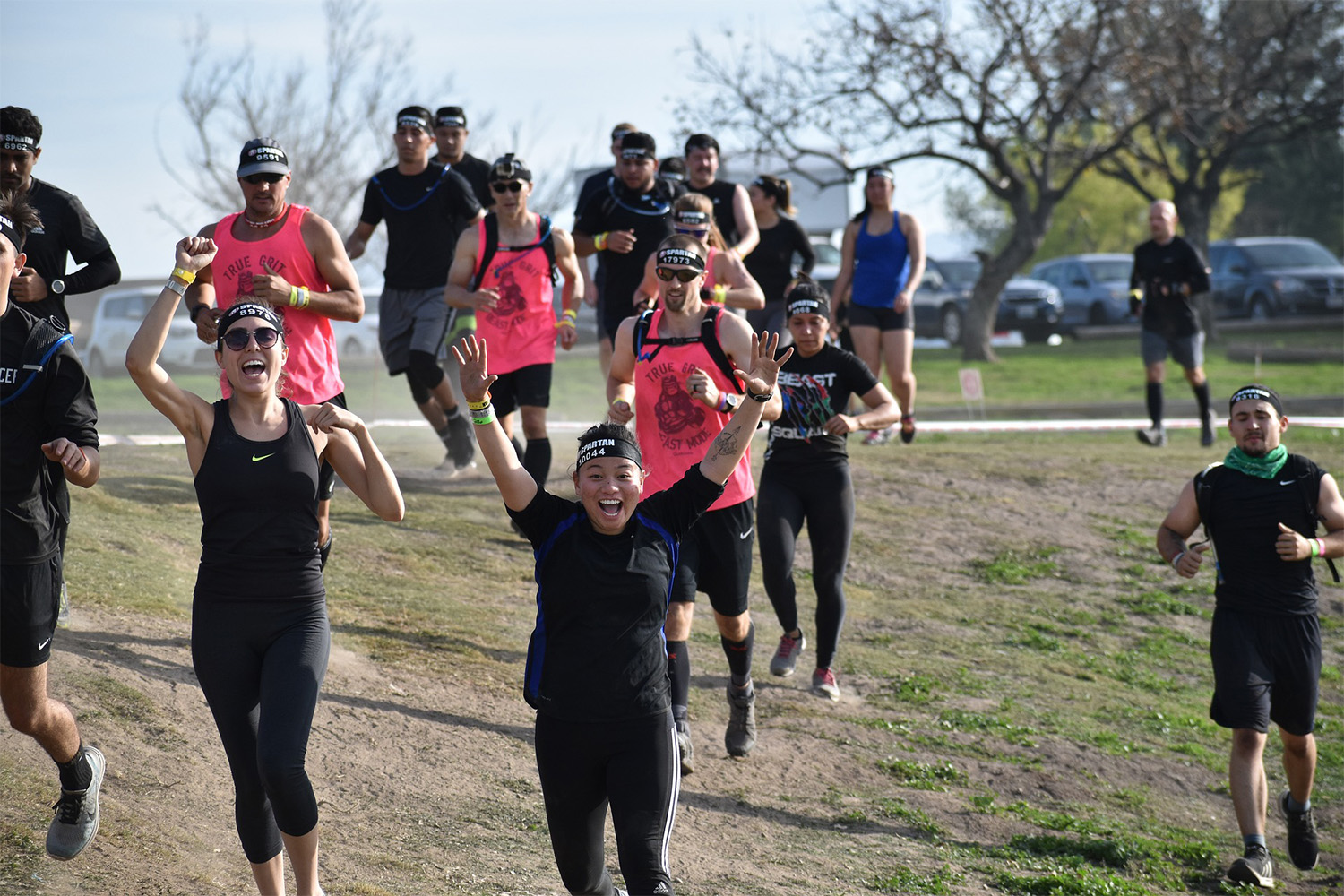 participants in the Spartan race arrive at the finish line 
