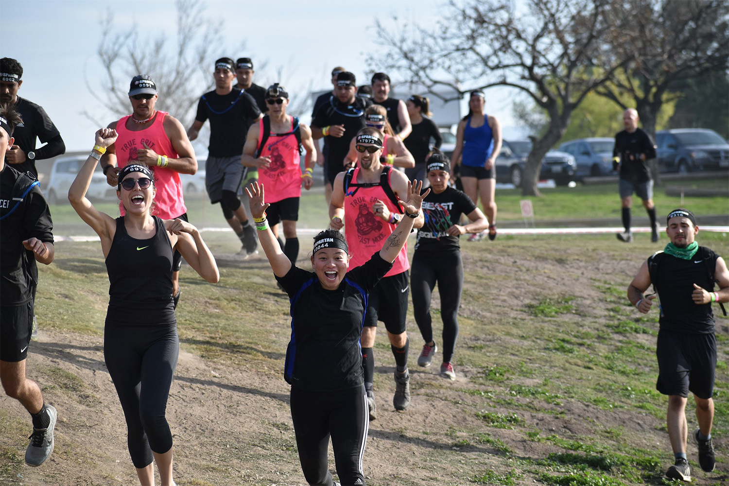 participants in the Spartan race arrive at the finish line