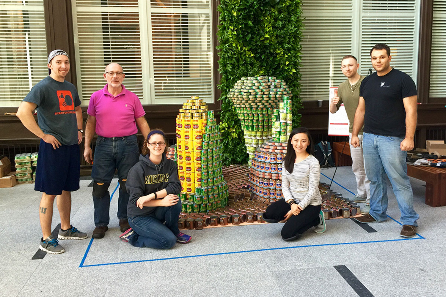 Tocci team poses for photo an CANstruction