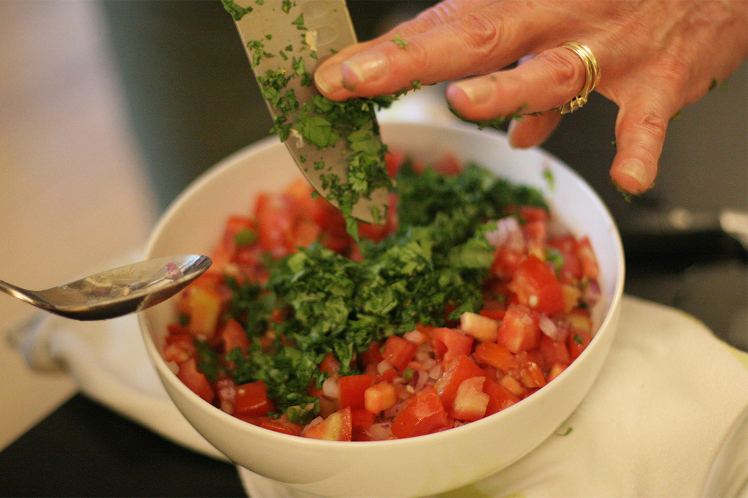 Chopped cilantro on top of pico de gallo.