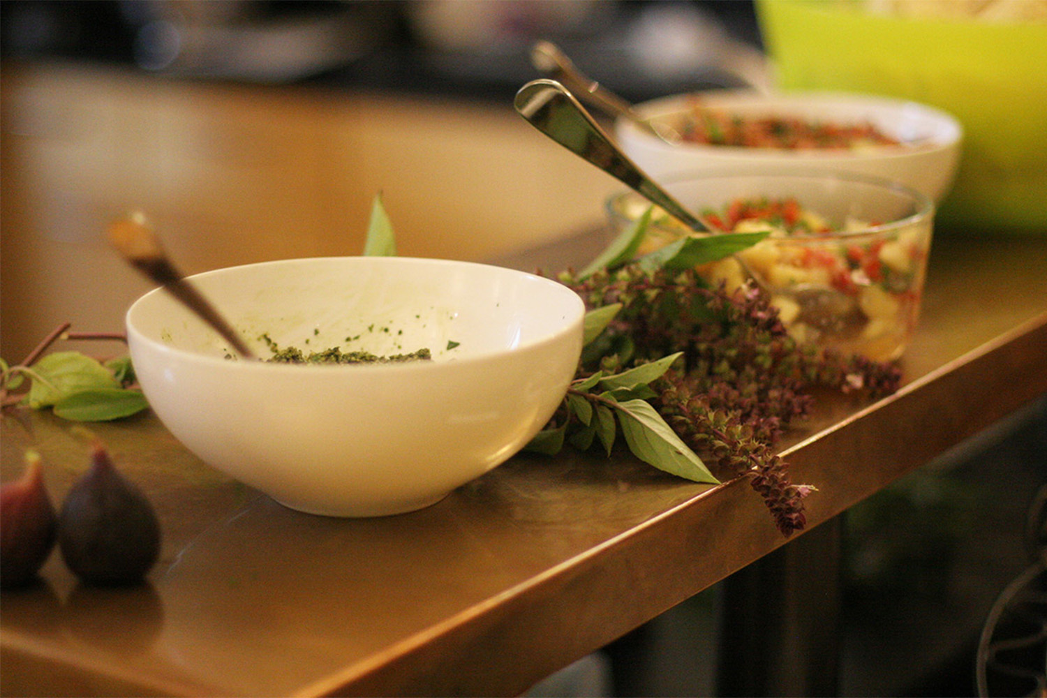 3 bowls of salsa, hummus, and a pesto dip