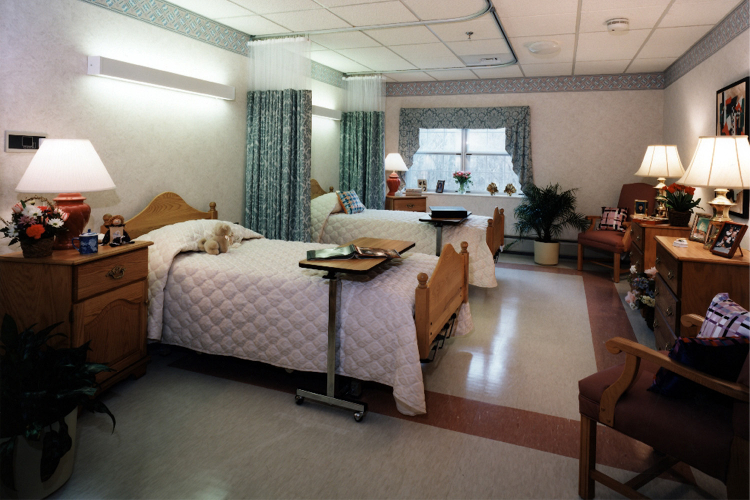 living area with two queen sized beds with quilted duvet covers