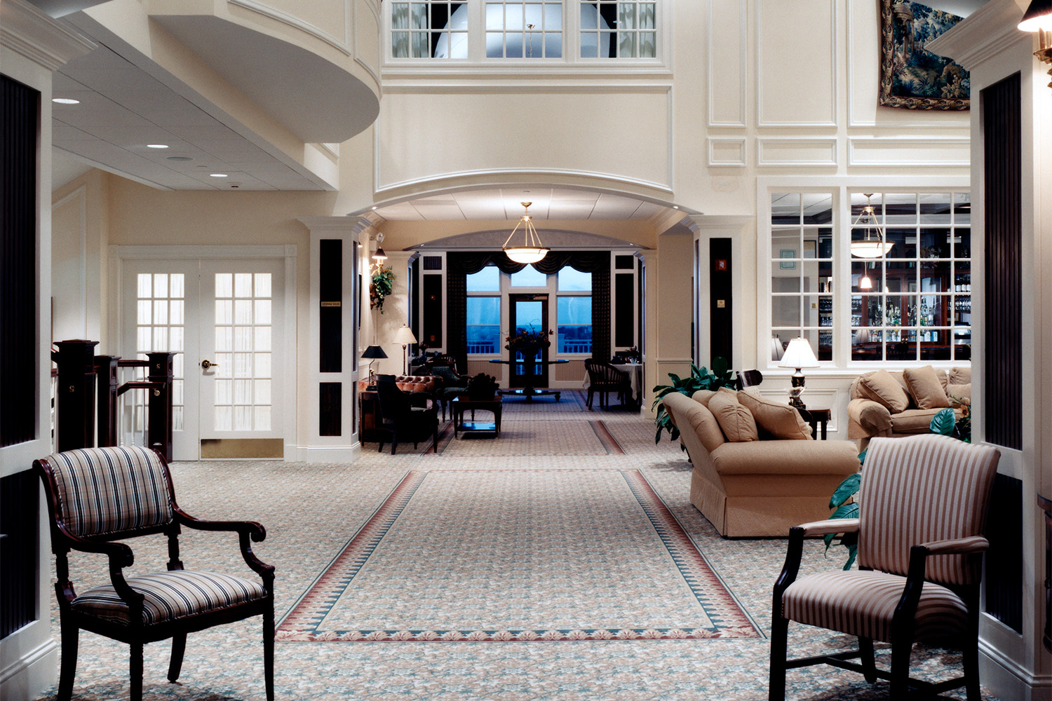 reception area of the clubhouse, with long rug leading in-between two chairs 