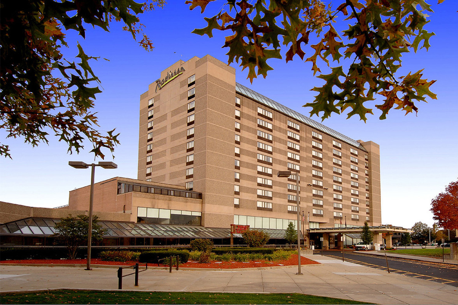 exterior view of the Manchester, NH Radisson Hotel, seen at dusk 