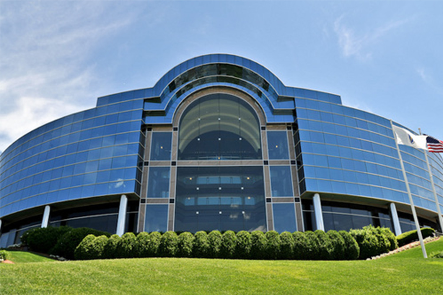 curved building exterior, composed of glass walls 