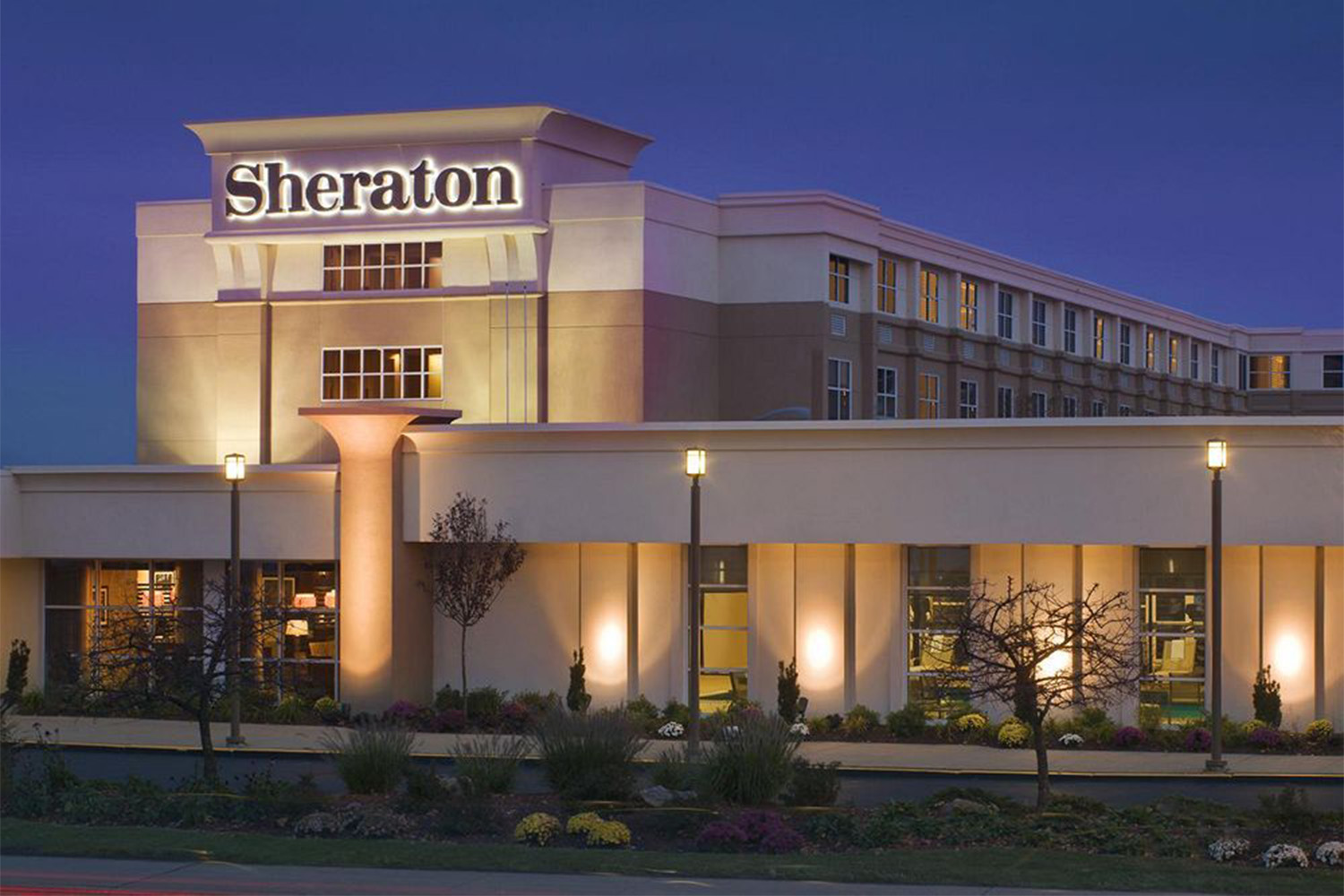 nighttime view of the Sheraton Airport Hotel exterior 