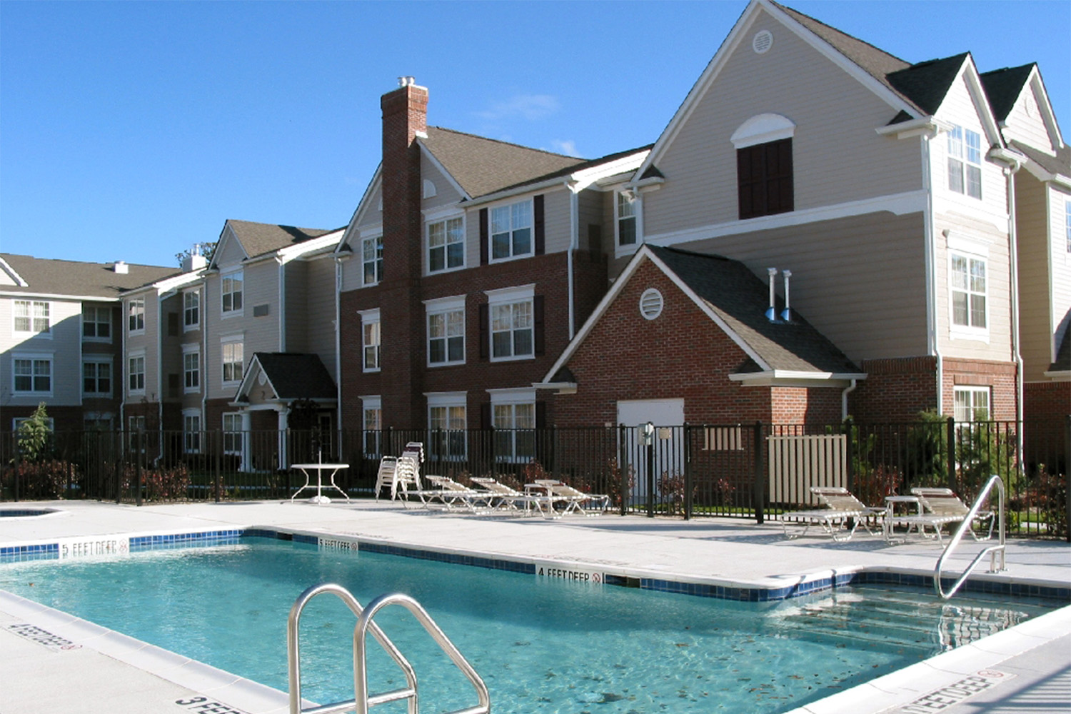 exterior of the Residence Inn hotel, seen from across pool 