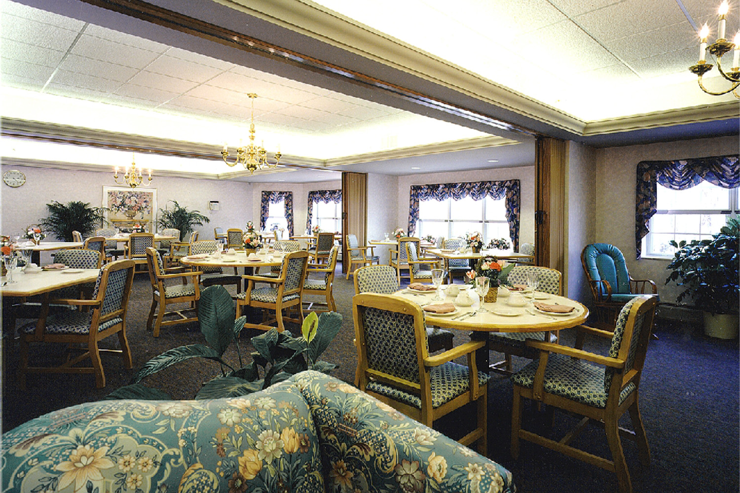 recreation area, with multiple couches with floral patterns 