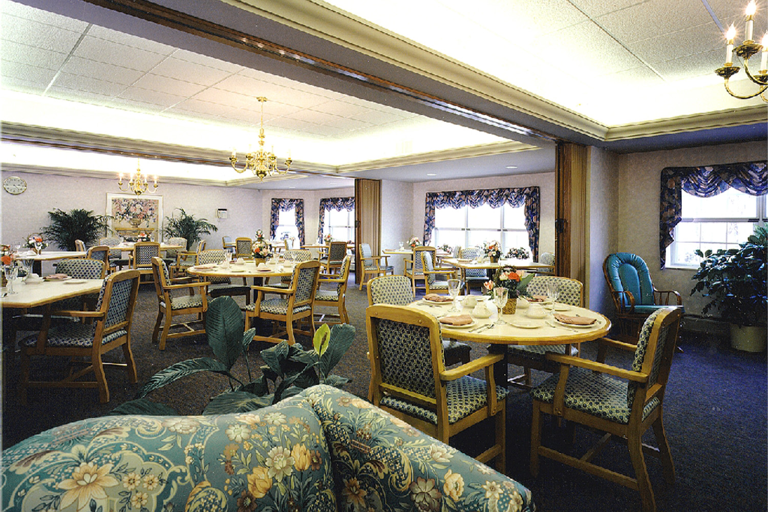 recreation area, with multiple couches with floral patterns