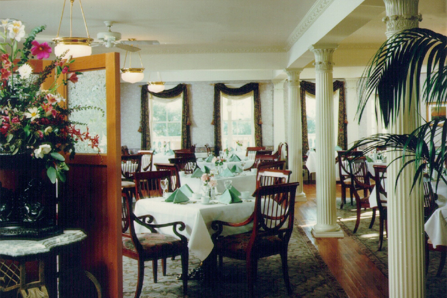 dining area with planters near the window sill 