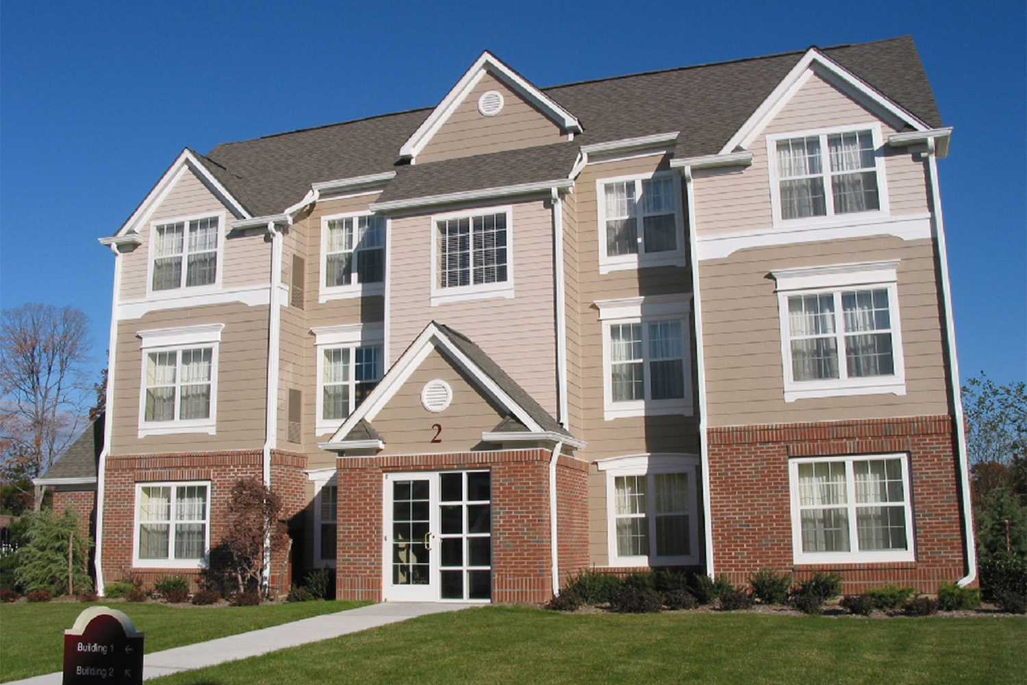 frontal view of residence inn house, with a cloudless sky 