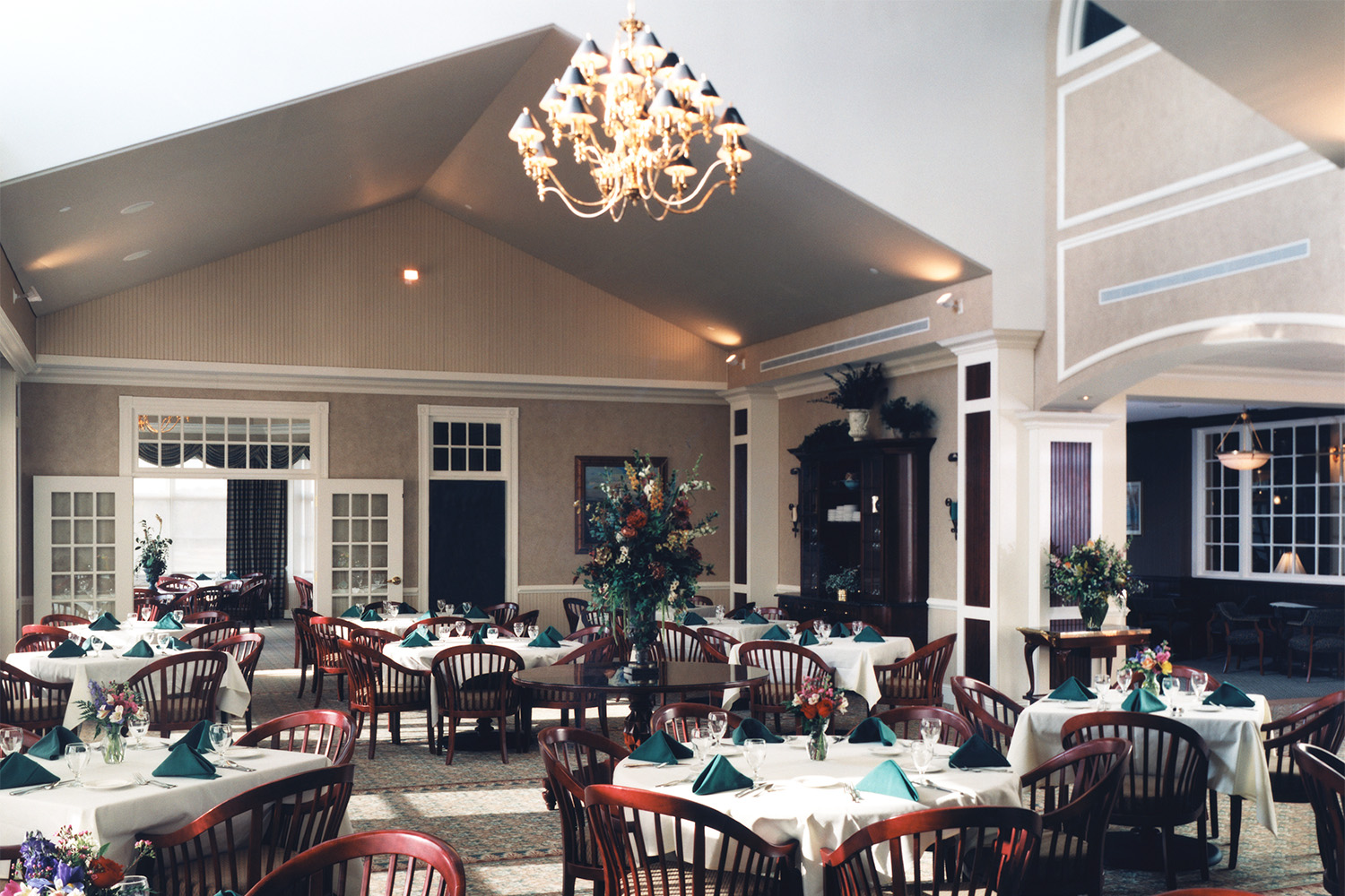 dining area with mahogany chairs and a chandelier 