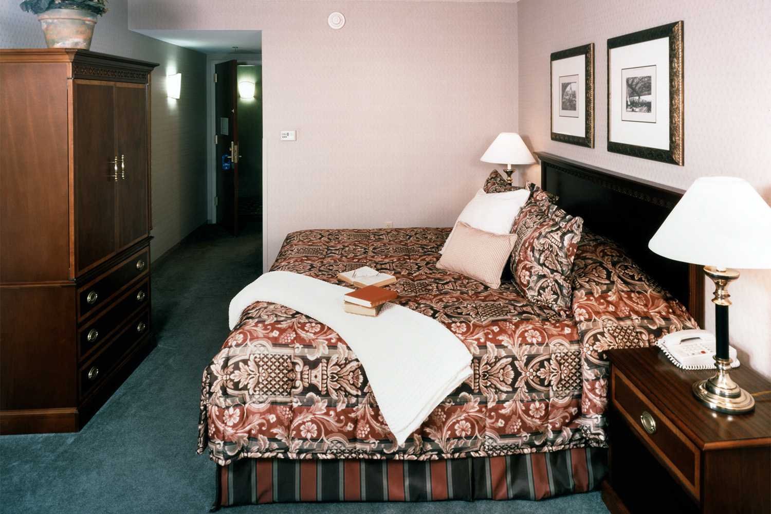 bedrooms' with burgundy sheets on bed 