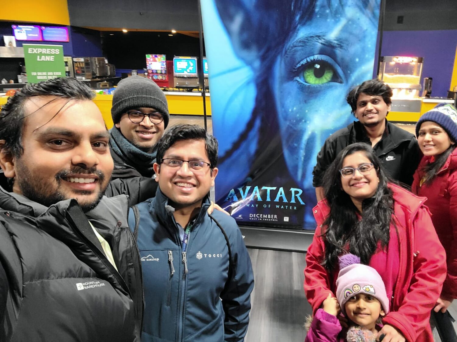 Rinkesh with family at a movie theatre 