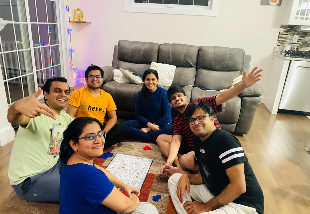 Rinkesh Gajera with family, playing board games in the living room 