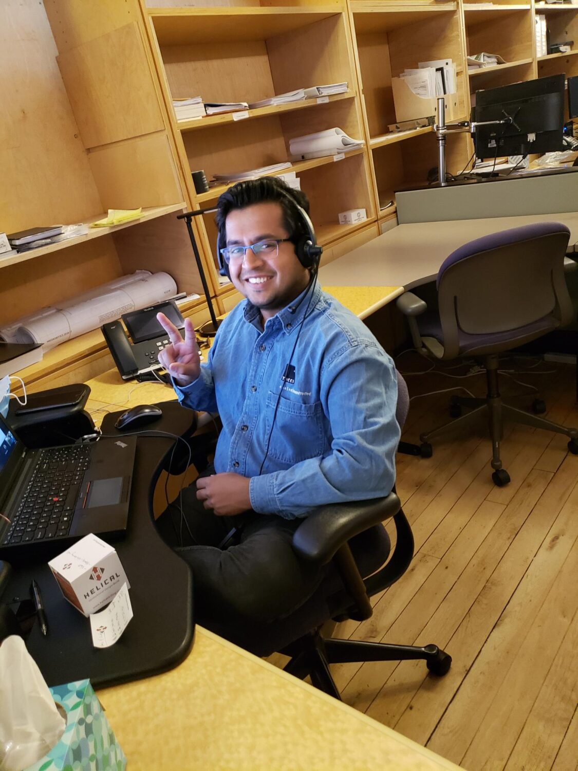 Rinkesh Gajera sitting by his office desk