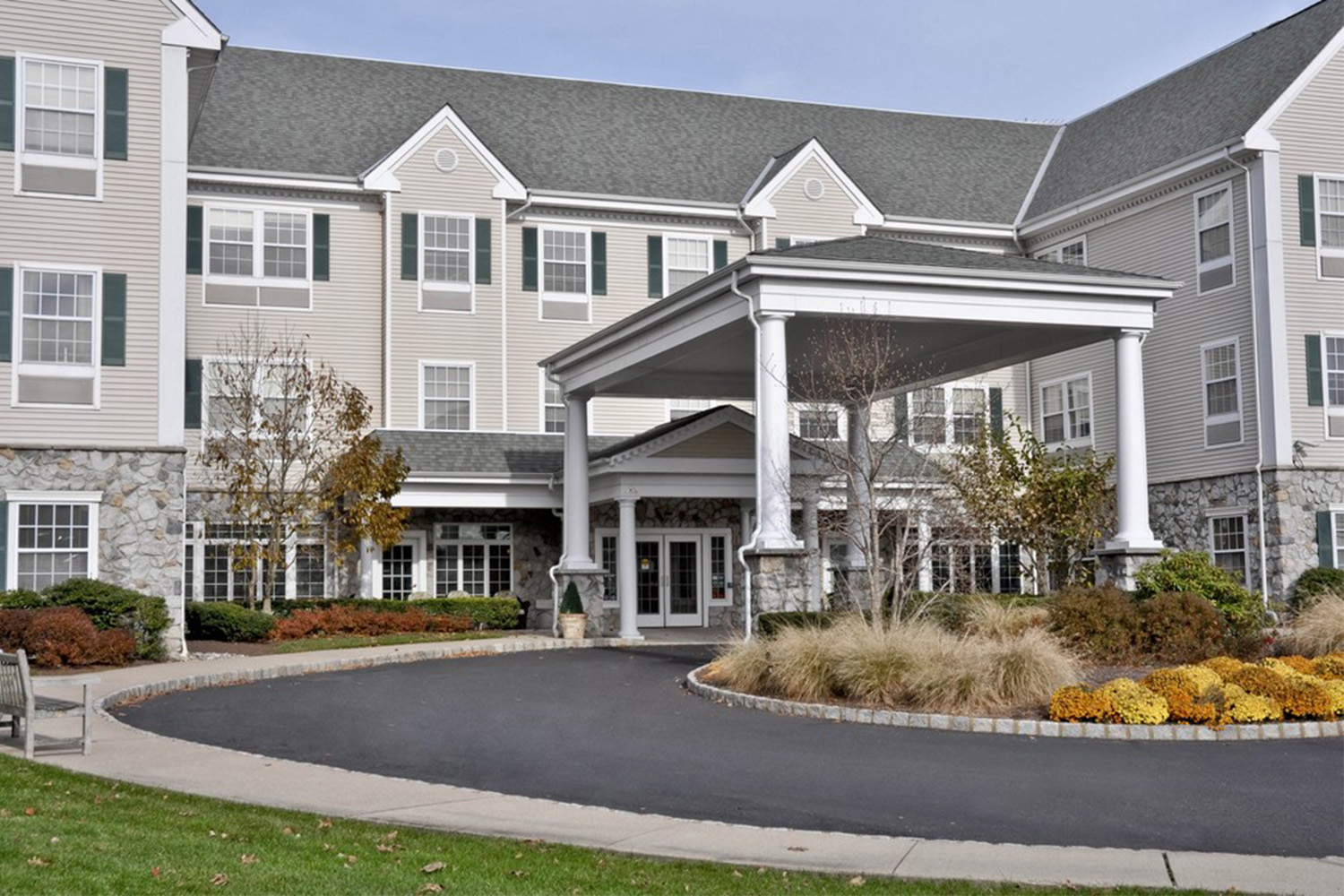 exterior view of Spring Meadows senior living, seen from the roundabout