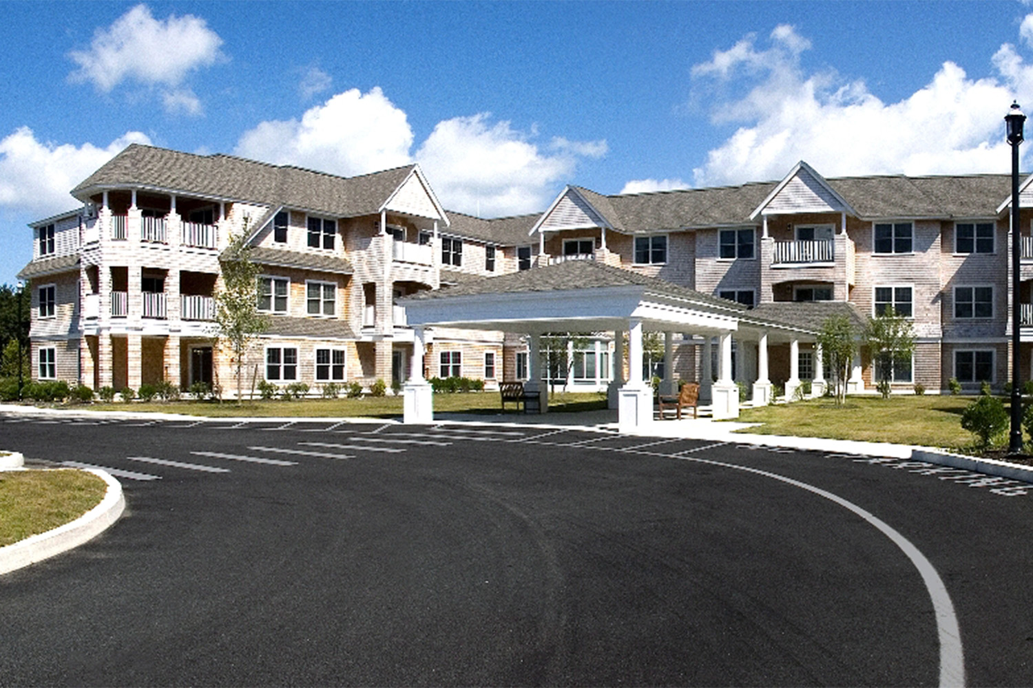 streetview of Dillingham Place, with fluffy clouds in the bright blue sunny sky