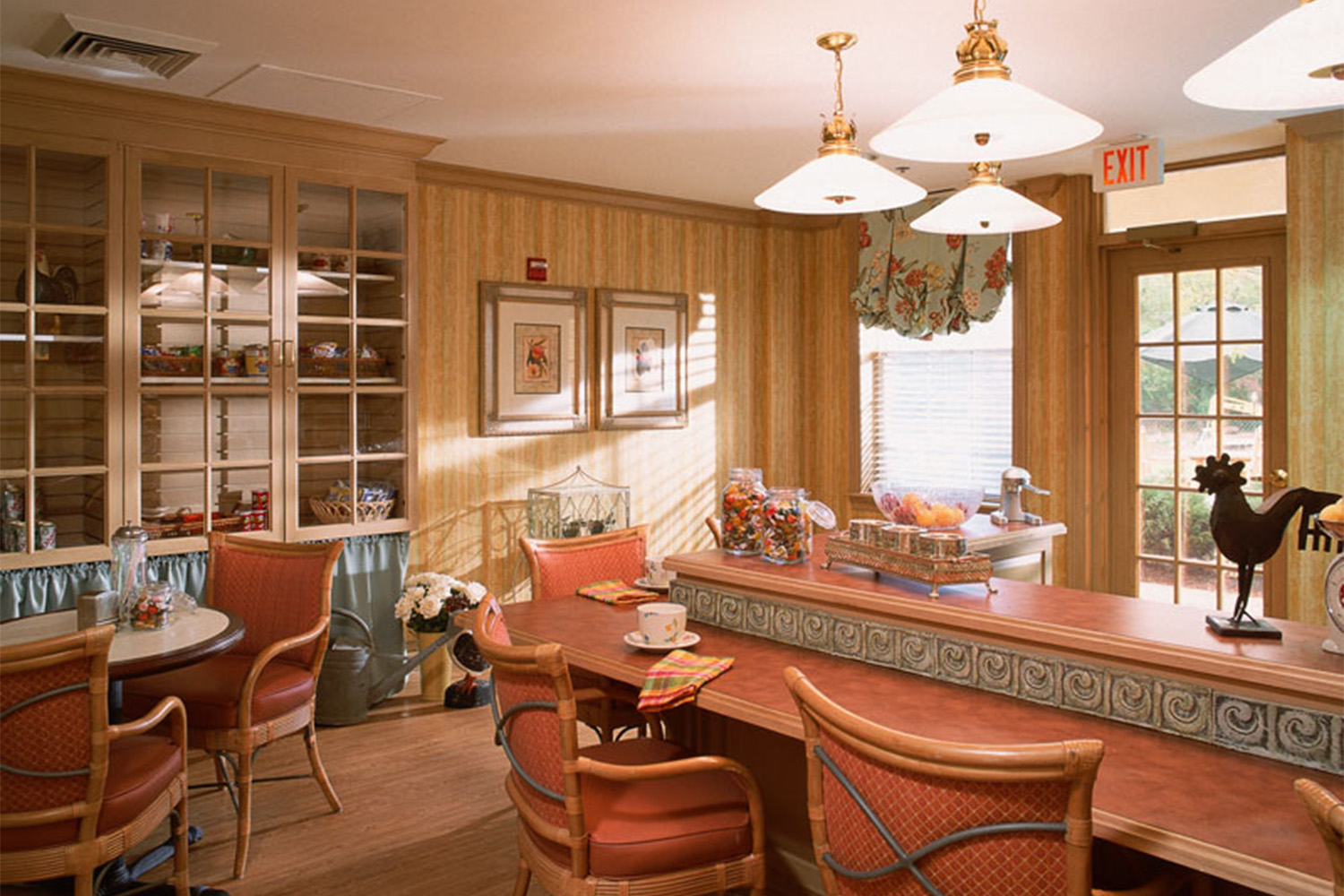 kitchen area with burnt orange colored chairs 