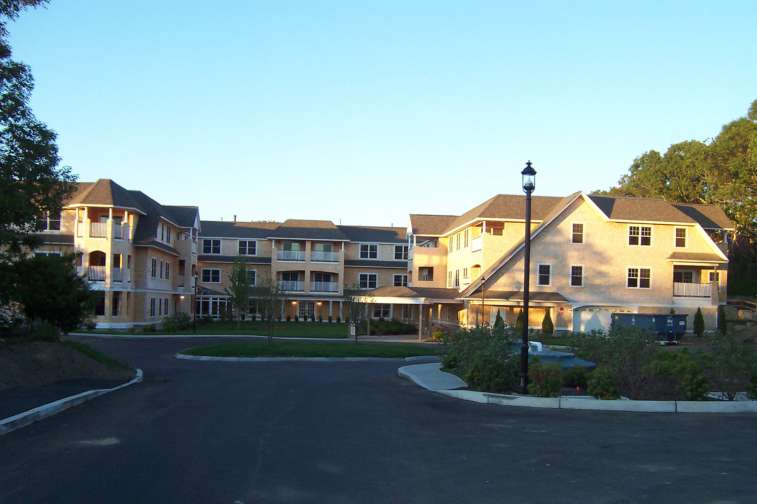 exterior view of the Orleans Place senior living facility, seen from a distance 