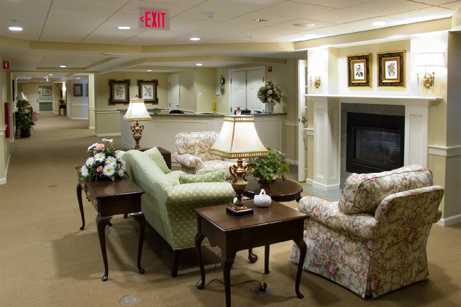 angled view of quaint lounge area with fireplace 