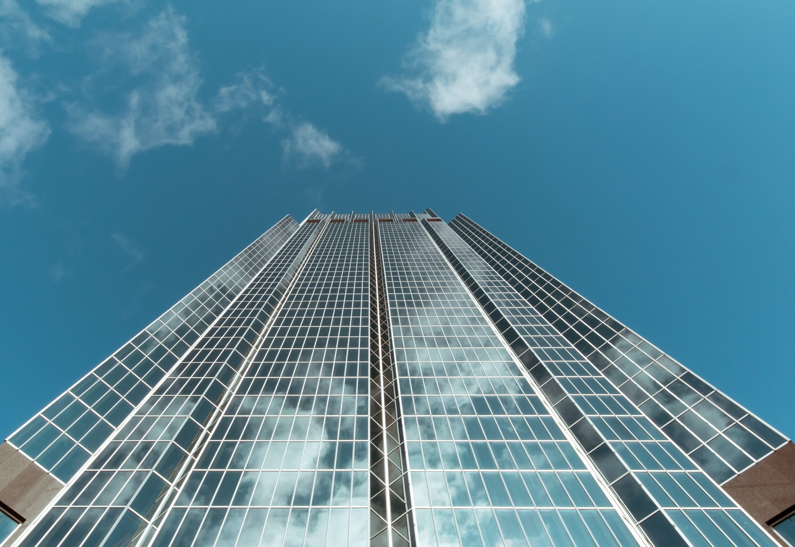 worm's eye view of skyscraper with plentiful glass windows 