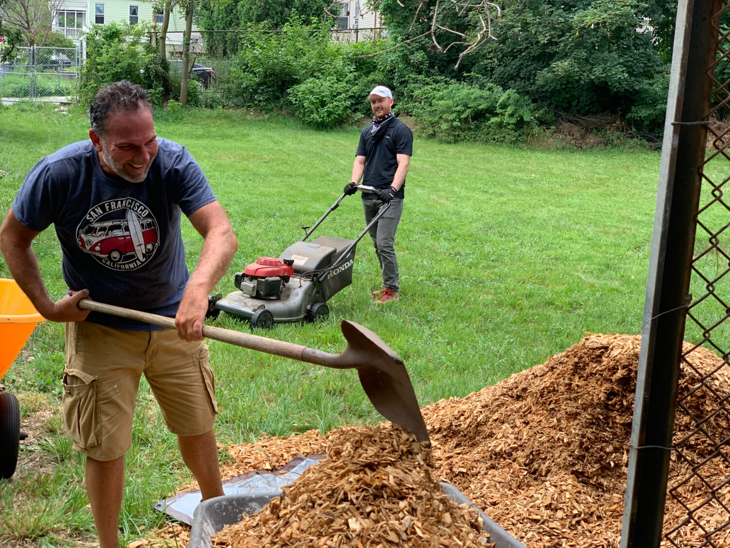 two Tocci employees doing yard work 